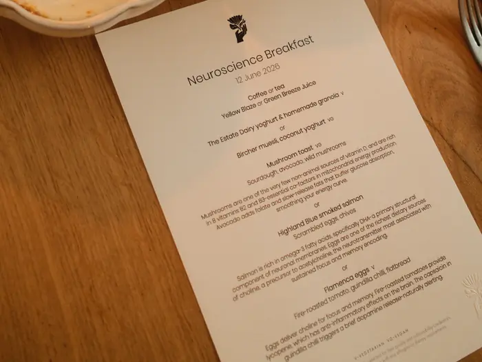 The printed menu card set on the table for the neuroscience brunch