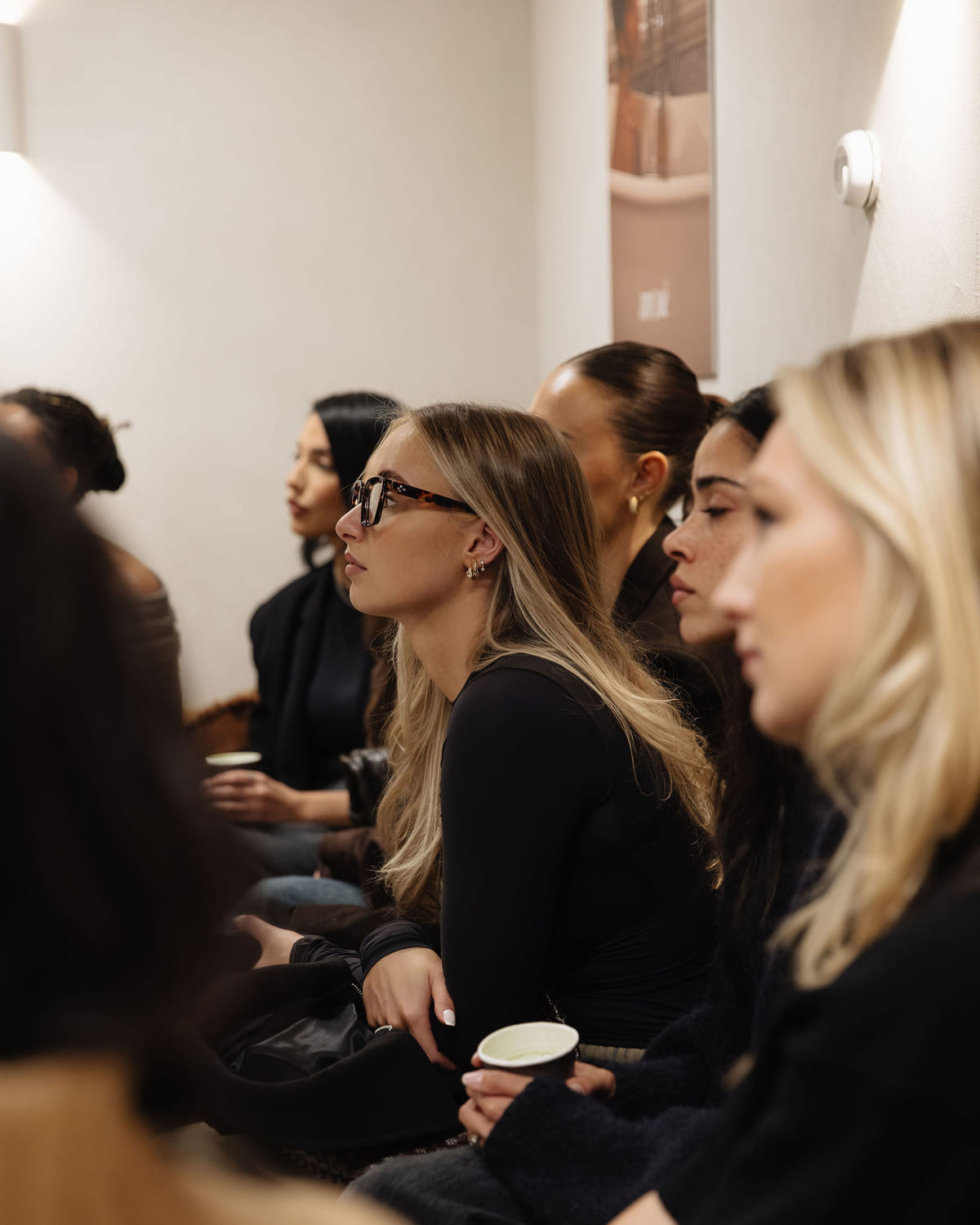 Attendees listening from the front row