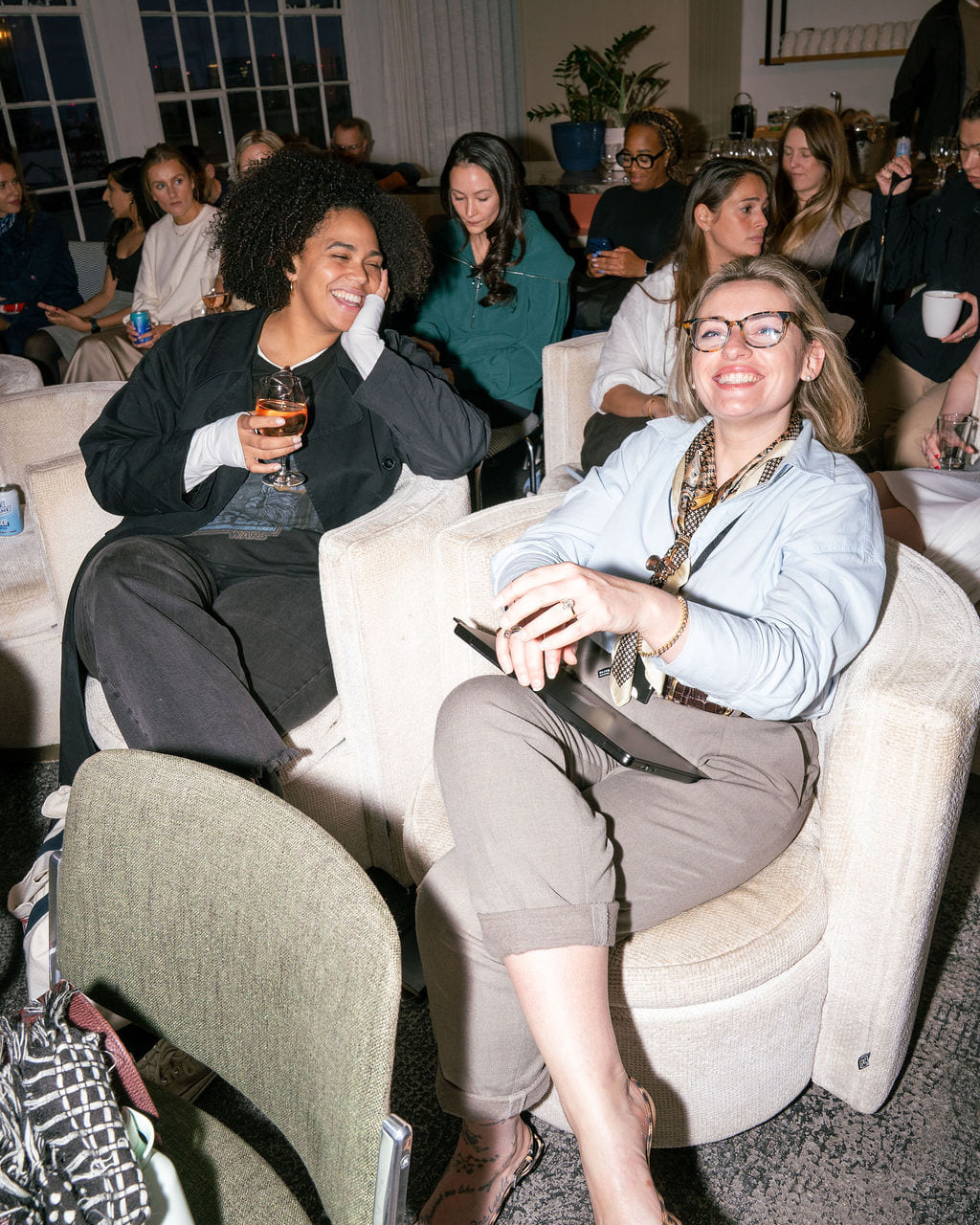 A fireside conversation in front of a seated audience